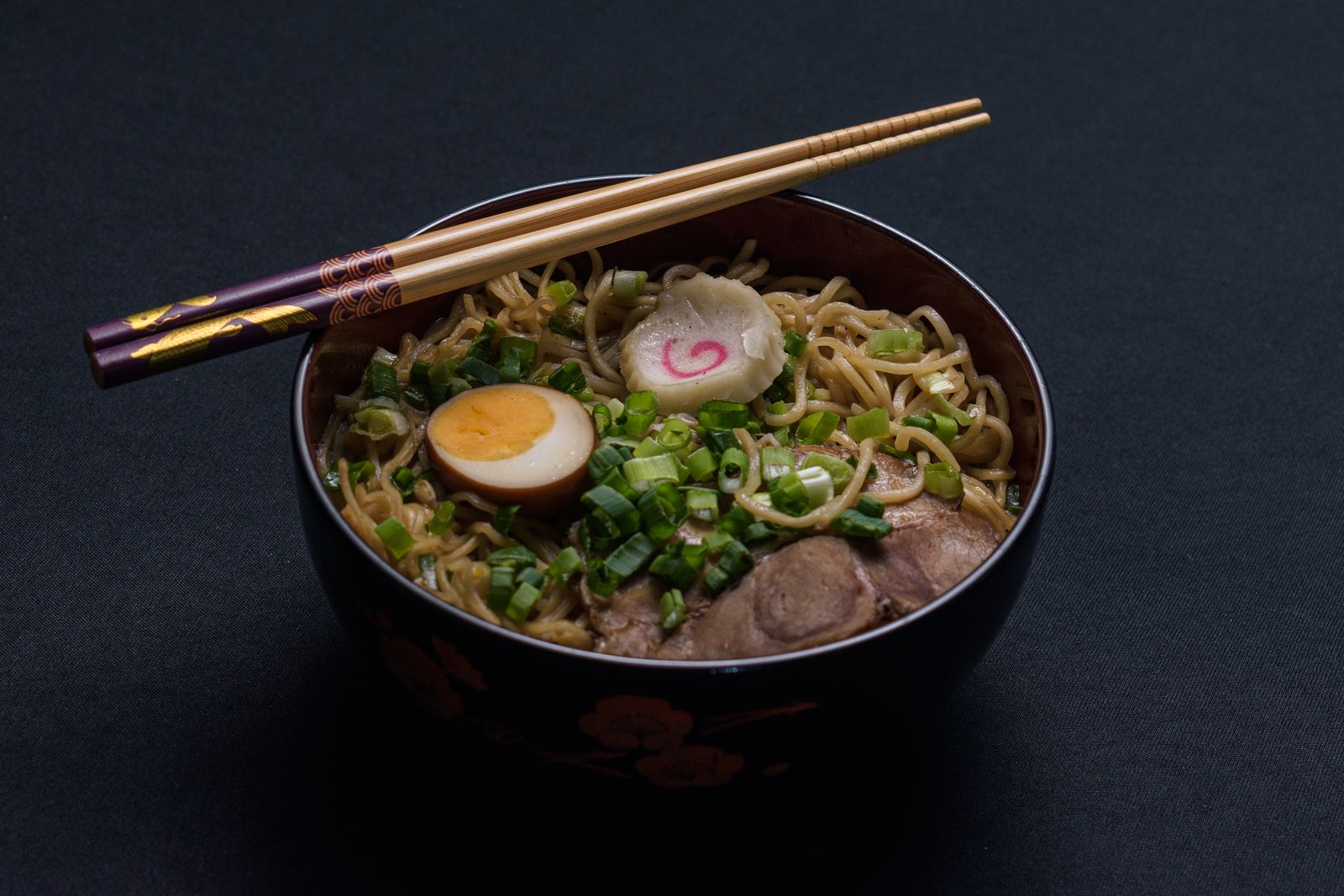 Minimalist wabi-sabi ramen bowl in soft window light